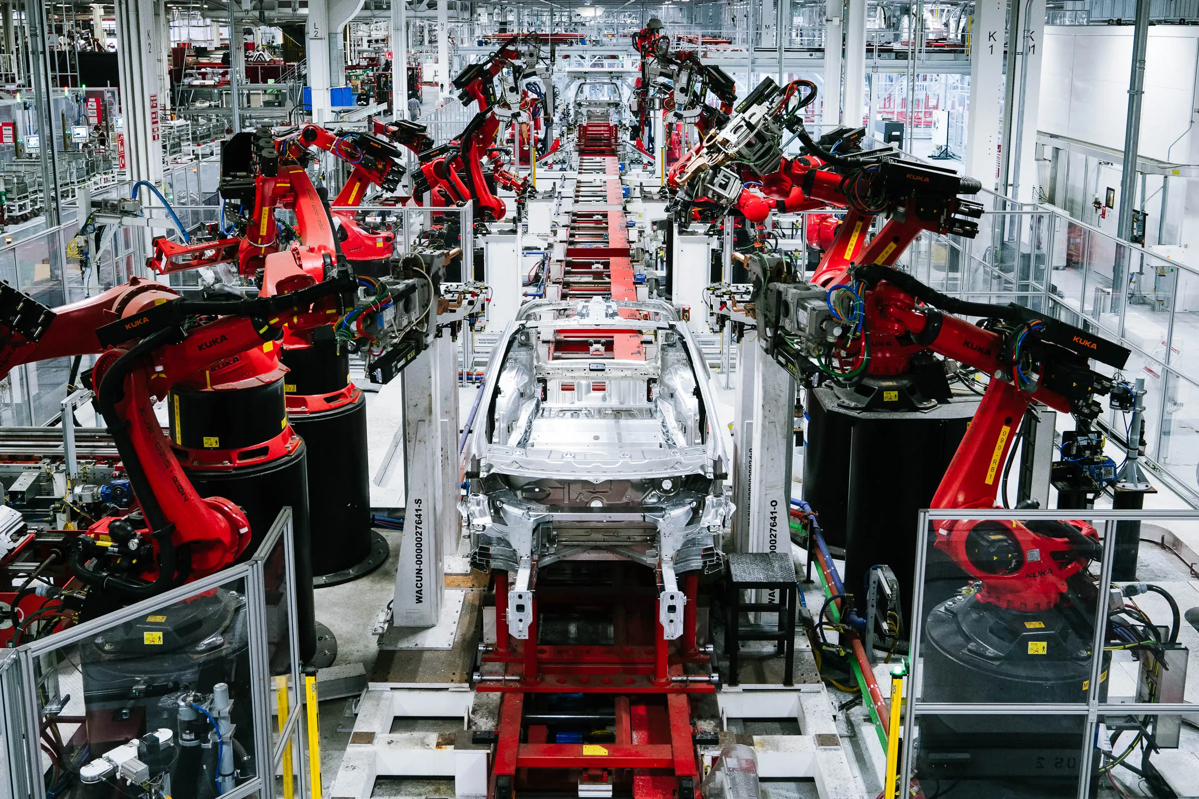 Gleaming Tesla gigafactory with robots and no people