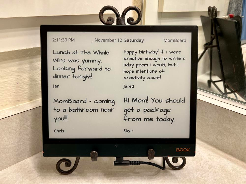 E-ink display on a bathroom counter showing birthday messages